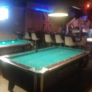 two pool tables in a bar