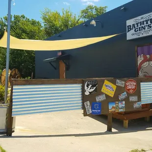 a blue building with a yellow awning