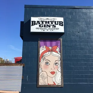 a woman's face painted on the side of a building