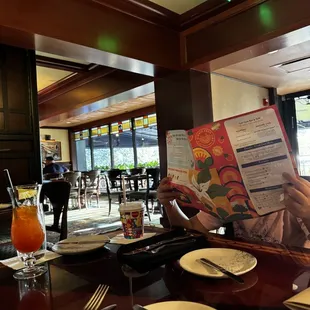 a man reading a menu