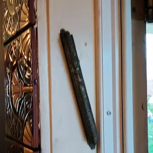 My guess is that the Mezuzah is a welcome holdover from the Malka decorating scheme.