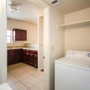 Separate laundry room with washer and dryer included.