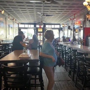 a group of people sitting at a bar