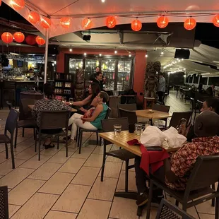 Balcony with entertainment.  There is a singer with his own music of choice.