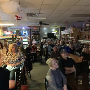 a large group of people sitting at tables