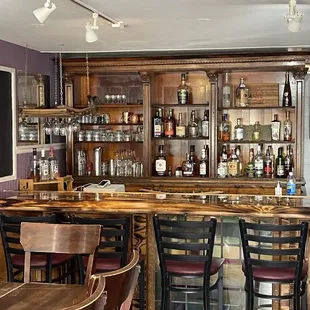 a bar with a lot of bottles