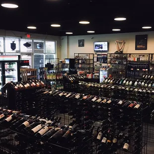rows of wine bottles in a store