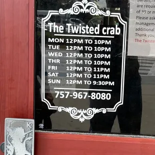 Hours posted on door in June 2022.