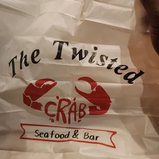 a hand holding a plastic bag