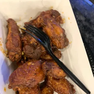 a plate of chicken wings