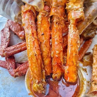 a plate of crab sticks with sauce