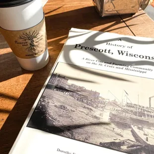 a book and a cup of coffee