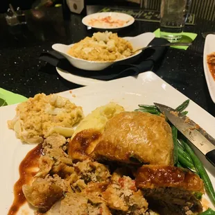 Pastry stuffed meatloaf with Yukon mashed potatoes and green beans. Sausage risotto