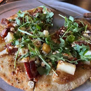 Twisted Pair pizza with pear, goat cheese, pancetta, arugula, fig preserves.