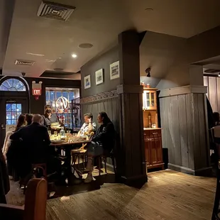 people sitting at tables in a restaurant