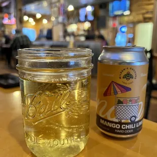 a can of mango chili next to a mason jar