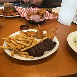 Surf and turf, salad, fries