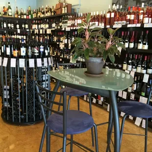 a table and chairs in a wine store