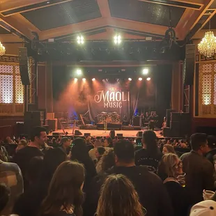 a crowd of people watching a concert