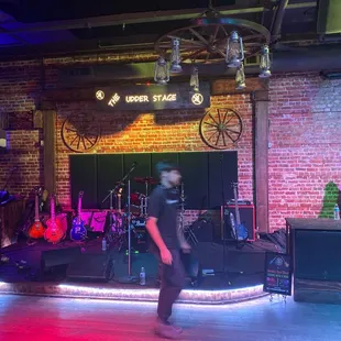 a man standing in front of a stage