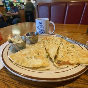 Breakfast Quesadilla with sour cream and hot sauce. Excellent.