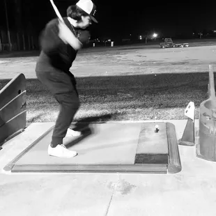 Having a blast hitting golf balls.
