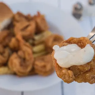 a plate of fried food and a fork