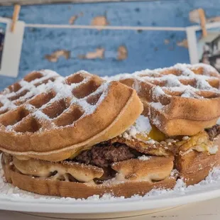 two waffle sandwiches on a plate