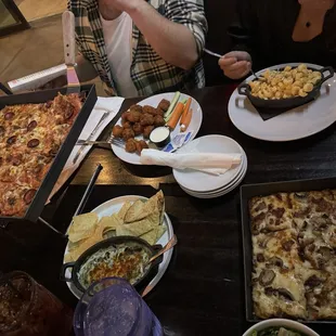a table full of food and drinks