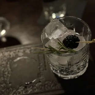 Drink comes cleverly disguised... pay no mind to the book on which this glass of ice sits!