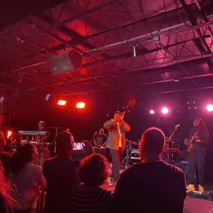 a band performing on stage at a concert