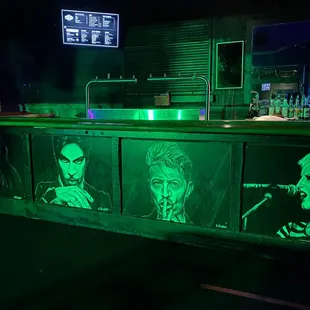 a bar with neon green lights