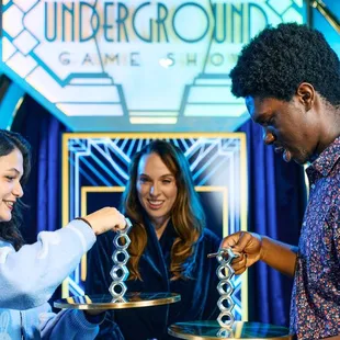 In addition to trivia, fun tactile challenges heat up the friendly competition.