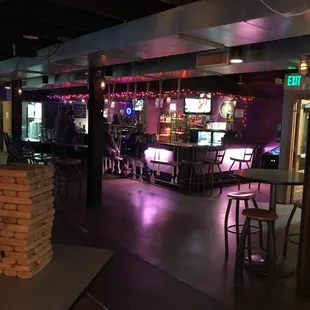 a bar with stacks of pizza on the counter