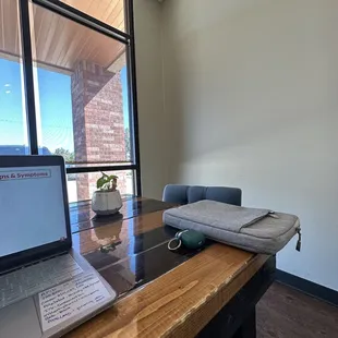 a desk with a laptop on it