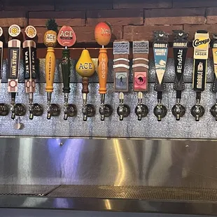 a row of beer taps