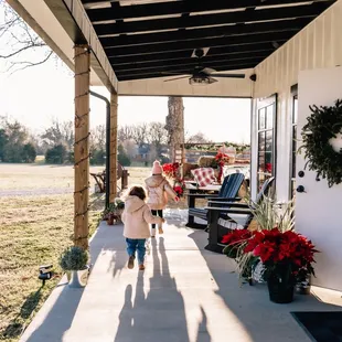 a woman and a child on a porch