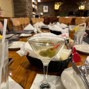 a martini with olives in it