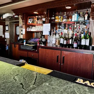 a bar with a green counter top
