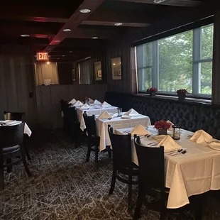 a dining room with tables and chairs