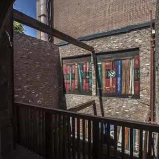 a view of a brick building through a window