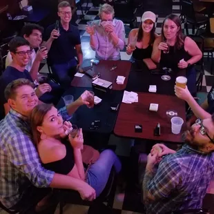 a group of people sitting around a table