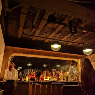 a man and a woman at a bar