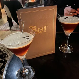 two cocktails on a table