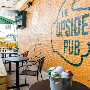 outdoor patio with TVs and umbrellas