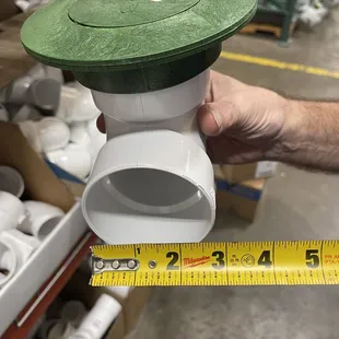 Here's a pop up valve for your lawn.  Better to distribute water from your roof out on the lawn instead of next to your foundation.