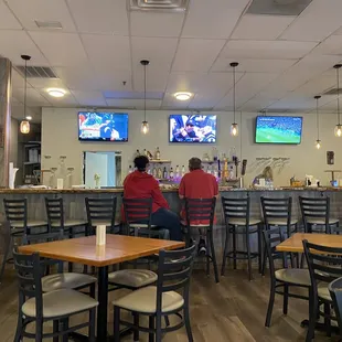 Family style tables and a beautiful bar option for ears and drinks.