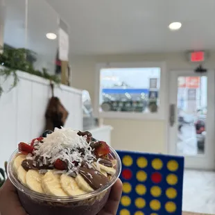 The urban bowl topped with fresh fruits, crunchy granola, and a drizzle of Nutella.
