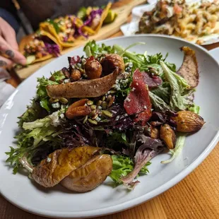 a plate of food with a salad on it