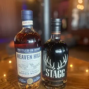 two bottles of liquor on a table